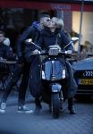 Amsterdam 14 maart 2018 
Caroline Tensen met zoon Bob Wisse en haar hondje op de vespa scooter