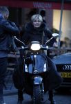 Amsterdam 14 maart 2018 
Caroline Tensen met zoon Bob Wisse en haar hondje op de vespa scooter