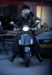 Amsterdam 14 maart 2018 
Caroline Tensen met zoon Bob Wisse en haar hondje op de vespa scooter