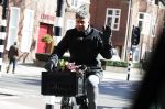 Amsterdam 22 maart 2018 
Frank Rijkaard met bloemen op zijn fiets