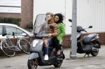 Amsterdam, 16 Maart 2019
Moise Trustfull met vriend op de scooter