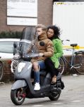 Amsterdam, 16 Maart 2019
Moise Trustfull met vriend op de scooter