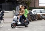 Amsterdam, 16 Maart 2019
Moise Trustfull met vriend op de scooter