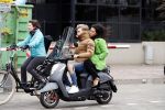 Amsterdam, 16 Maart 2019
Moise Trustfull met vriend op de scooter