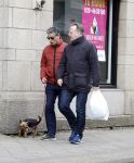Amsterdam 15 april 2023
Gerard Spong met partner en hondje op straat in Amsterdam zuid.