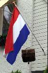 geslaagd
Vlaggestok met vlag en boekentas