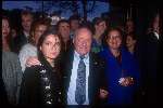 Johnny Kraaijkamp Sr. met vrouw en dochter
op achtergrond Johnny Kraaijkamp Jr.