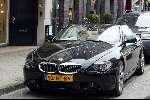 Amsterdam 2 april 2004
Gordon en Christine Kroonenberg op pc hooftstraat in bmw 645 CI Cabrio