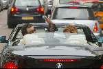 Amsterdam 2 april 2004
Gordon en Christine Kroonenberg op pc hooftstraat in bmw 645 CI Cabrio