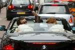 Amsterdam 2 april 2004
Gordon en Christine Kroonenberg op pc hooftstraat in bmw 645 CI Cabrio