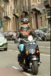 Amsterdam 9 april 2004
Manuela Kemp op scooter in Amsterdam