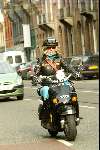 Amsterdam 9 april 2004
Manuela Kemp op scooter in Amsterdam