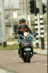 Amsterdam 9 april 2004
Manuela Kemp op scooter in Amsterdam