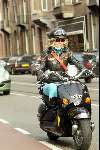 Amsterdam 9 april 2004
Manuela Kemp op scooter in Amsterdam