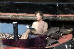 Amsterdam 3 april 2005
Jeroen Pauw leest boek  met ontbloot bovenlijf op zijn boot.