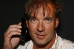 Rotterdam 28 juni 2006
Miss femmefone in de Jackie in rotterdam. Gerard Joling met gsm
PeterSmulders bv