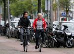 Amsterdam 30 juli 2011
Youp van t Hek en zijn zoon Julius op de fiets.
Peter Smulders bv