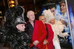 AMSTERDAM - Bij het Tuschinski Theater is de premiere van Behind the Candelabra. Met op de rode loper  Arjan Ederveen met partner.