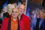 AMSTERDAM - Bij het Tuschinski Theater is de premiere van Behind the Candelabra. Met op de rode loper  Arjan Ederveen met partner.