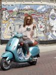 Amsterdam 9 augustus 2013
Glennis Grace op haar Vespa scooter in Amsterdam zuid. 
Peter Smulders bv