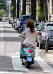 Amsterdam 9 augustus 2013
Glennis Grace op haar Vespa scooter in Amsterdam zuid. 
Peter Smulders bv