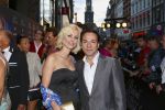 AMSTERDAM - Bij het Tuschinski Theater is de premiere van Behind the Candelabra. Met op de rode loper  Spiros Chalos met partner Lisa Chalos-Oostwoud.