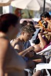 ibiza 28 juli 2015
Estelle Cruijff Joelle Gullit Lilly Becker met zoon Amadues Becker en een zoon uit een eerder huwelijk van Boris op het strand van Talamanca.