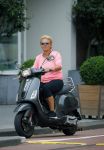 Amsterdam 10 augustus 2015
Caroline Tensen op haar Vespa scooter rijdend door Amsterdam
