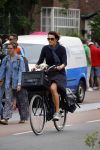Amsterdam 12 augustus 2015 
Susan Visser met hondje op de fiets.