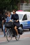 Amsterdam 12 augustus 2015 
Susan Visser met hondje op de fiets.