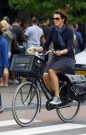 Amsterdam 12 augustus 2015 
Susan Visser met hondje op de fiets.
