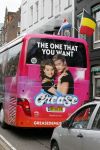 Amsterdam 15 augustus 2015
Tim Douwsma en  VajÃ¨n van den Bosch de hoofdrolspelers van de musical Grease staan groot op de bus