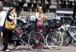 Amsterdam 1 juli 2015 
Trijntje Oosterhuis zwanger met fiets en een vriendin