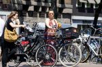 Amsterdam 1 juli 2015 
Trijntje Oosterhuis zwanger met fiets en een vriendin