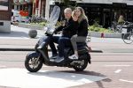 Amsterdam 6 juli 2016 
Hajo Bruins met ik denk zijn oudste dochter op de scooter