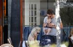 Amsterdam 17 juli 2018
Chantal janzen met man Marco Geeratz en hun zoontje op etrras en achter de kinderwagen.
