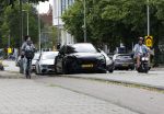 Amsterdam 16 juli 2023
Birgit Schuurman met zoontje op de fiets . Haar vriend Sander v Haarlem rijdt op scooter