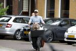 Amsterdam 14 juli 2023
Davy Klaassen met vriendin en hond op de bakfiets in Amsterdam zuid.