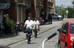 Amsterdam 4 juli 2024
Twan Huys met zijn vrouw op de fiets in het centrum van Amsterdam.