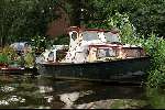 24 juli 2002  Amsterdam
Roestig schip aan de Amstel
Sloepenroute