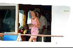 Porto Ercole 6 augustus 2003
Mabel Wisse Smit op de Jumbo VI met beveilingsbeambte en opachtergrond Prins Willema Alexander