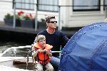 Amsterdam 1 augustus 2004
Martijn Krabbe met Amanda (zwanger) en Bikkel op sloep varen  in de grachten van Amsterdam