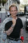 Amsterdam 31 augustus 2005
Presentatie Glamour en Lady card in Amstel hotel.
Johan Vlemmix met tatoo shirt