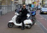 Amsterdam 23 november 2015
Maik de Boer op zijn vespa scooter op straat
