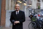 Amsterdam 23 november 2015
Maik de Boer op zijn vespa scooter op straat