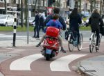 Amsterdam 18 november 2015 
Martijn Krabbe met zijn zoon achilles op vespa scooter