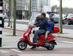 Amsterdam 18 november 2015 
Martijn Krabbe met zijn zoon achilles op vespa scooter