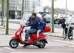 Amsterdam 18 november 2015 
Martijn Krabbe met zijn zoon achilles op vespa scooter