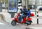 Amsterdam 18 november 2015 
Martijn Krabbe met zijn zoon achilles op vespa scooter