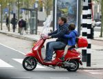 Amsterdam 18 november 2015 
Martijn Krabbe met zijn zoon achilles op vespa scooter